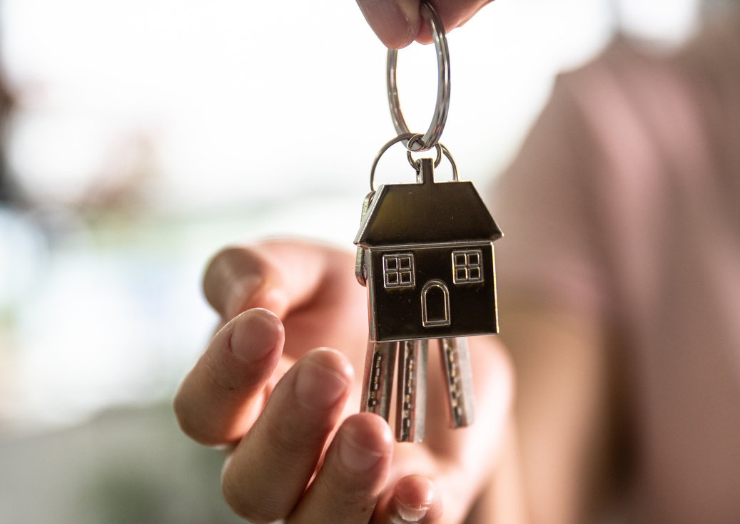 Giving keys to new house owner