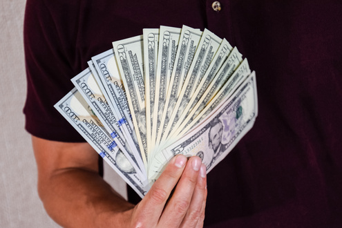 Dollars Are Held by Fan by a Man in His Hand. Us Dollar.